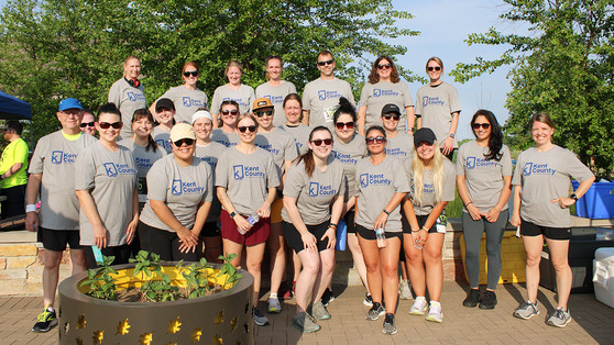 Picture of a group of staff members, all wearing Kent County tshirts