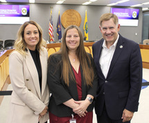 Image of Tricia Phinney, with Board Chair Stan Stek and District Court Administrator Danielle Castillo