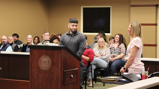 Image of a defendent talking in a courtroom