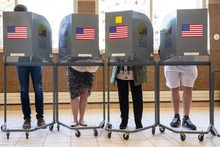 Image of people voting