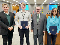 Image of award recipients Melissa Denson and Nicholas Young, with Administrator Vanderberg and Board Chair Stek