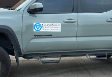 Image of a truck with the Grand Valley State University Biology Department logo on the side