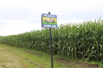 Preserved Farmland sign in front of corn field