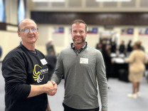 Parks Operations Manager Josh Mattice shakes hands with Construction Supervisor John Concannon 