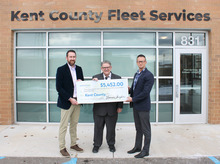 Image of the check presentation between county officials and Consumers Energy