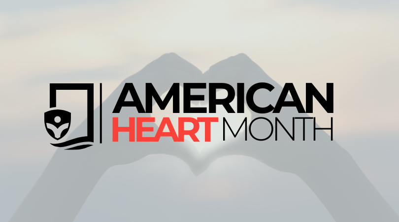 Text States, 'American Heart Month' with an Image of Hands Joined Together to Form a Heart in the Background