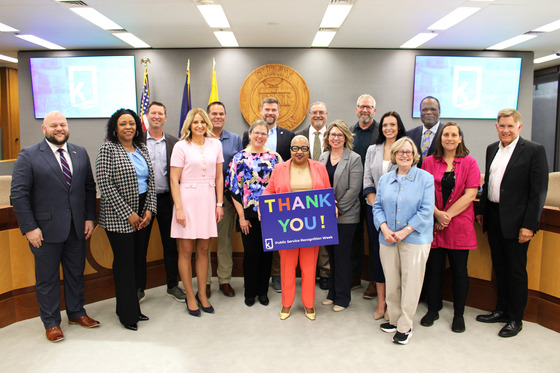 Image of Kent County Commissioners holding sign
