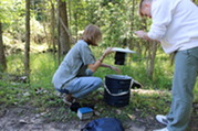 Mosquito Surveillance Team Setting Up a Mosquito Trap