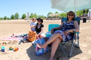 Family Soaking Up Some Sunshine at Millennium Beach