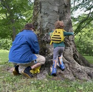Blandford Educator and a Young Boy Enjoying the Nature Neighbors Bumble Bee Walk