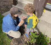 Blandford Educator and a Young Boy During the Nature Neighbor's Bumble Bee Walk