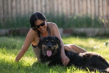 Image of a woman with her dog in the summer