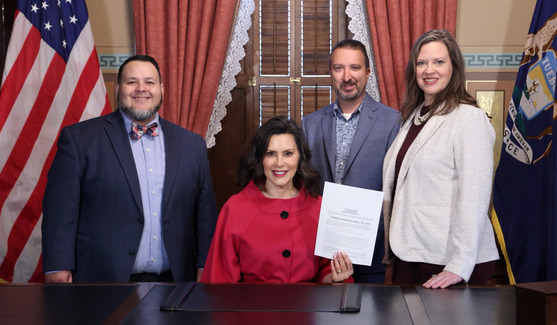 Brian McGrain and Gustavo Perez at bill signing with Governor Gretchen Whitmer