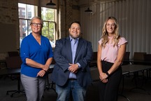 Image of Gustavo Perez with reps from Heart of West Michigan United Way and 