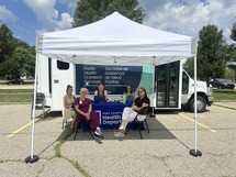 Picture of a team of KCHD employees supporting the mobile measles clinic.