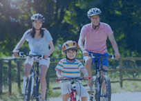 Image of a family riding bikes