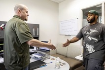 Image of a veteran shaking hands with the Veterans Services officer