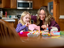 Image of a mother and child doing crafts at a table