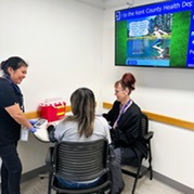 A woman sits down for an appointment with our WISEWOMAN program staff
