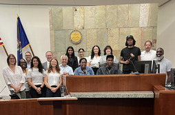 County staff, judges and commissioners with young people at the court
