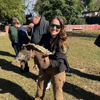 Animal Control Officer holding a giant turtle