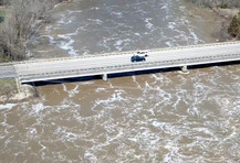 Image of high waters under a bridge
