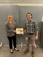 Environmental Health Clerk Suzanne VanderVeen Accepts the People's Champion Award for June