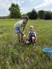 Two Young Boys Smile as They Take Part in a Stewardship Day at Caledonia's Creekside Park