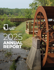 Cover Photo of the Parks 2025 Annual Report Featuring the Water Wheel at Dwight Lydell Park