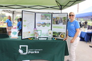 Parks Volunteer Coordinator Jessie Schulte Hosts a Table at Kent County's North Community Fest Last Summer
