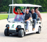 Northland Drive Pedestrian Tunnel tour, with people on a golf cart