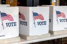 Image of three voting tabletop signs