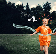 Young Girl Running on a Soccer Field