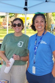 Two Kent County Health Department Employees Smile for the Camera at a Community Event