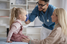 Doctor examining a child