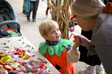 Child receiving Halloween candy