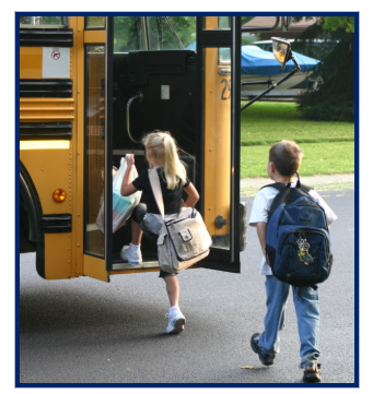 Children approaching and loading onto schoolbus