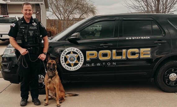 Officer Sontag and K-9 Kilo with patrol car