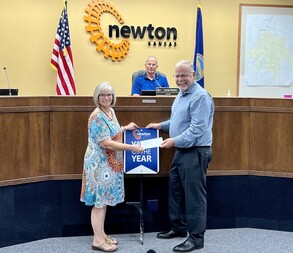 Yard of the Year award presented to Donna Ratzlaff by Commissioner Rich Stinnett