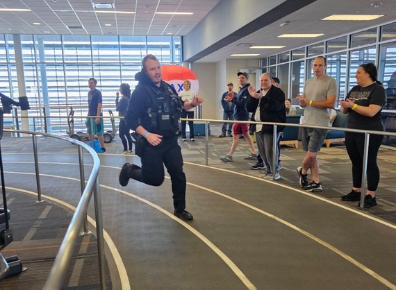 Police officer runs in YMCA Race for Health