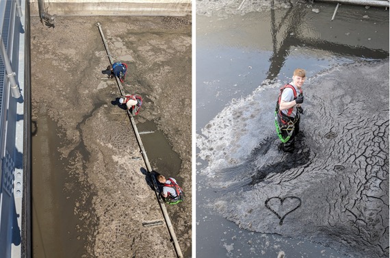 Staff clearing a clogged digester at sewer plant; employee with heart drawn in surface scum