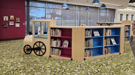 Train bookshelf in children's area at library