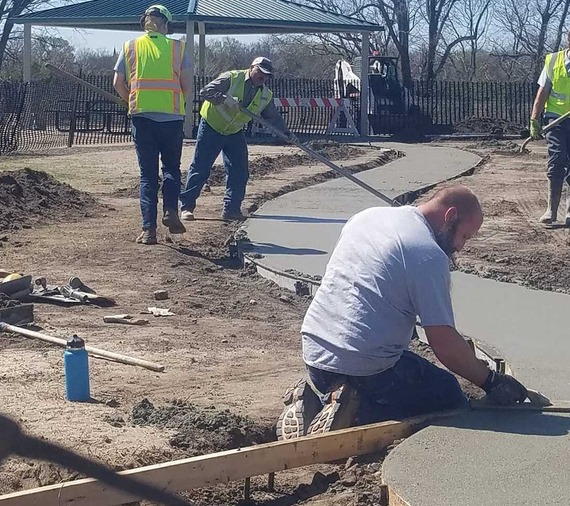 Street crew doing concrete work on new sidewalk