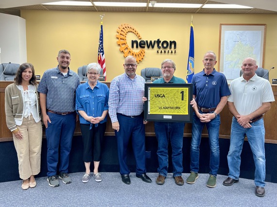 KemperSports staff present signed Adaptive Open flag to City Commission