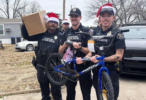 Police officers delivering Blue Christmas gifts