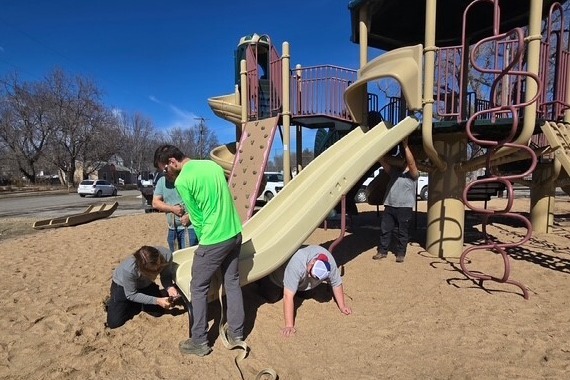 Park crew replacing slide at 10th & Ash Park