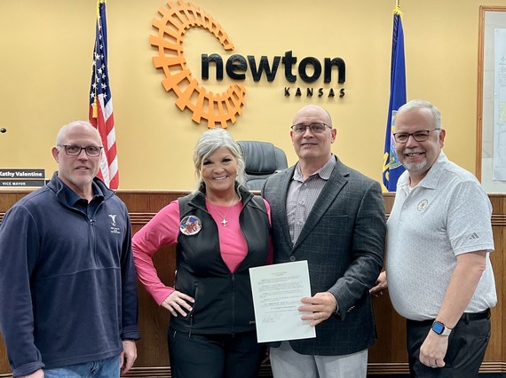 Wyatt Hendrickson's parents and coach with mayor