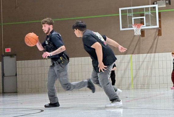 Newton officers play kickball with Opportunity Academy students