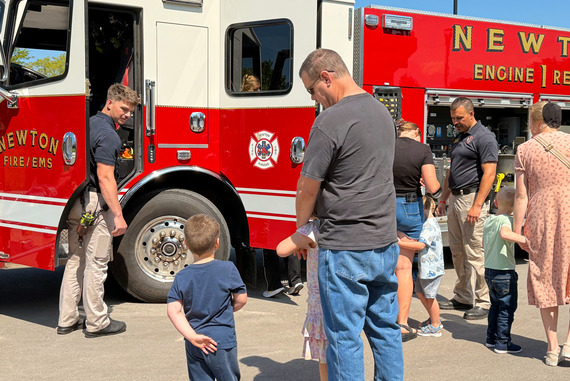 Families check out fire truck at library story time