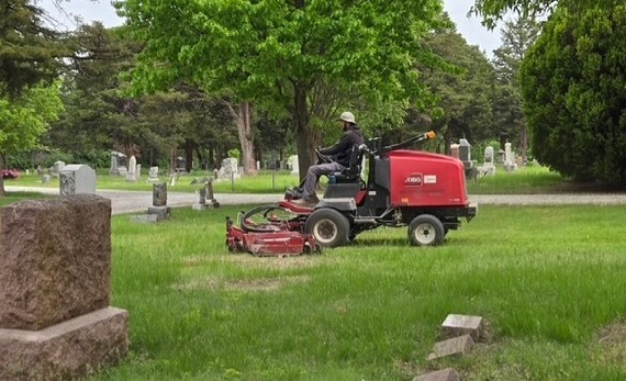 Mowing at cemetery